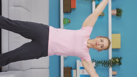 Vertical-video-of-The-woman-doing-gymnastics.